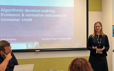 Holli delivers her paper at the SLS
