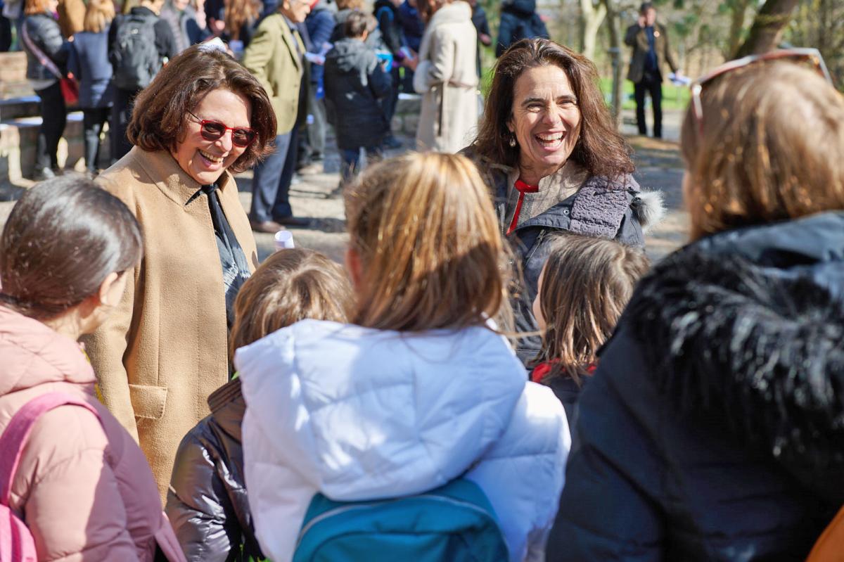 Mrs Gabriel Cox and Mrs Emanuella Gillard talk with children at the ceremony 